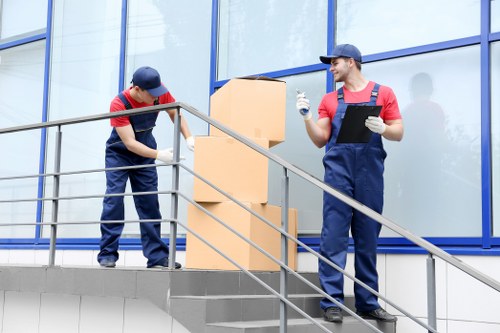 Professional movers handling office equipment in London