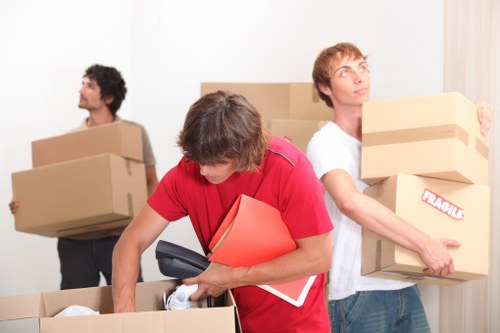 Professional movers handling furniture with care